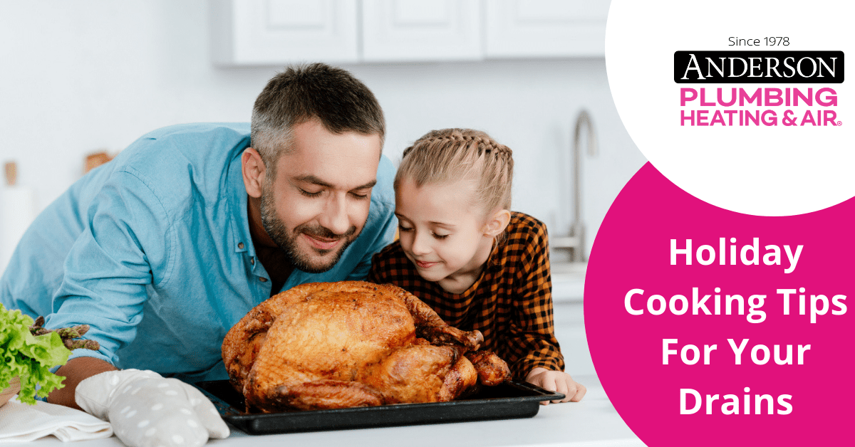 Father and daughter baking holiday turkey