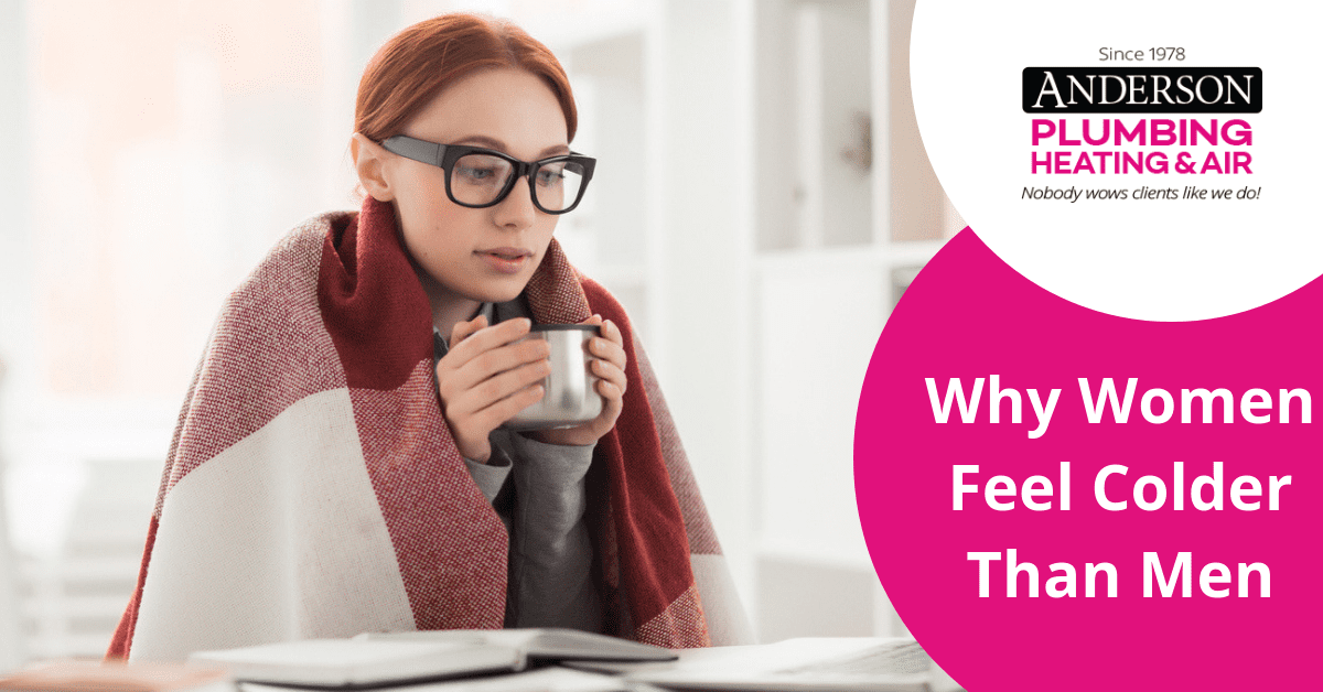 Woman in the office trying to stay warm with a blanket and coffee