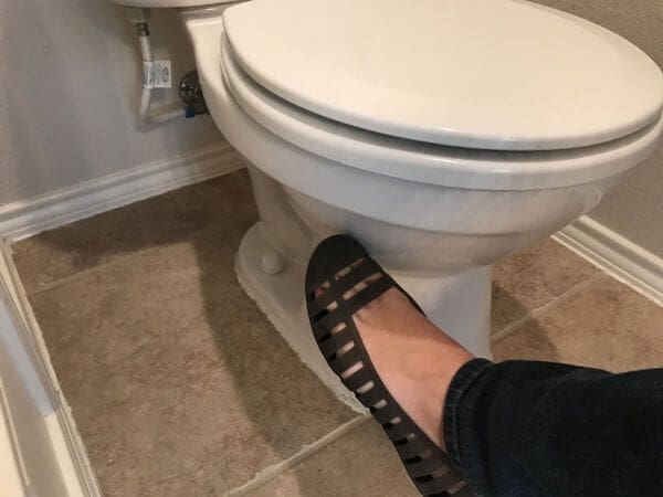 Woman Kicking Toilet